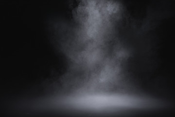 empty floor with smoke on dark background