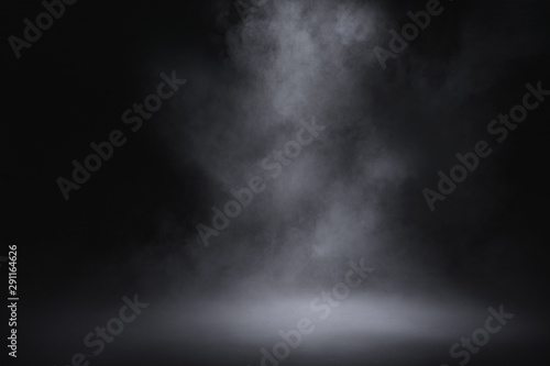 empty floor with smoke on dark background photo