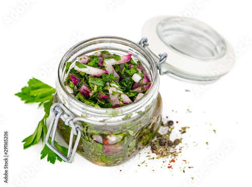 Some Homemade Chimichurri isolated on white (selective focus)