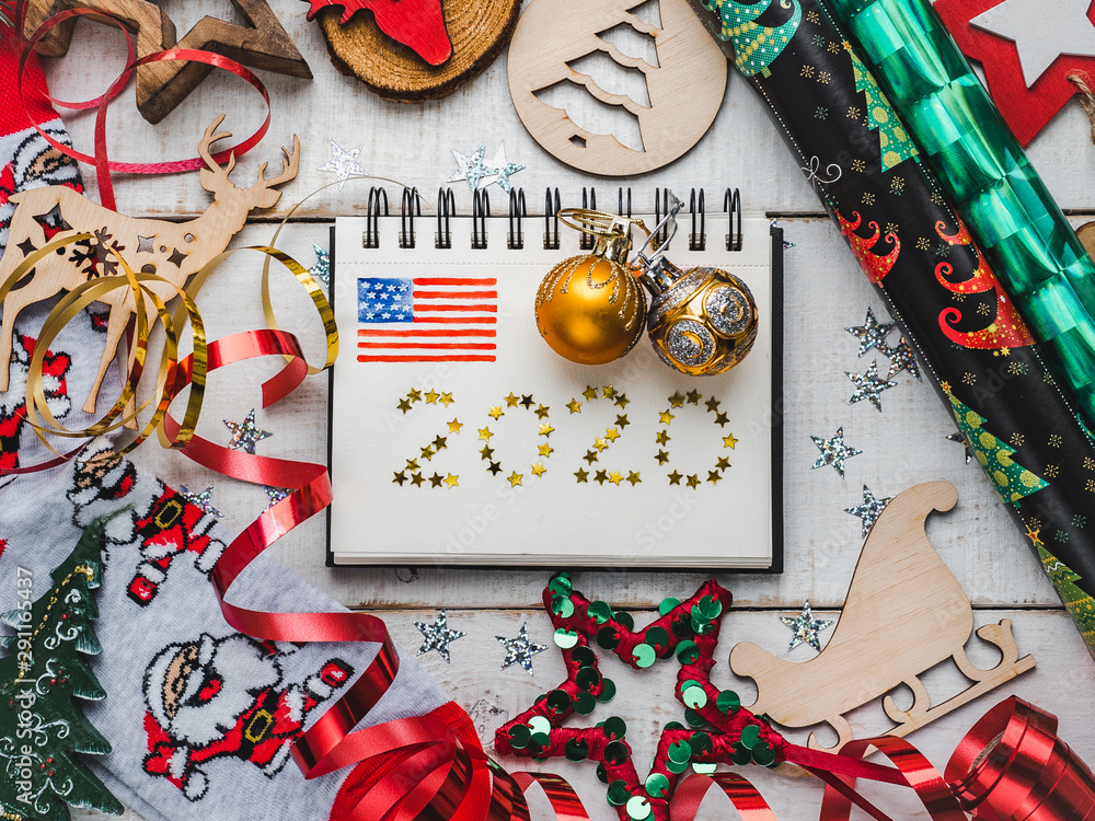 Fototapeta premium Merry Christmas and Happy New Year. Beautiful card with Christmas decorations. View from above, close-up, flat lay. Congratulations to loved ones, family, relatives, friends and colleagues