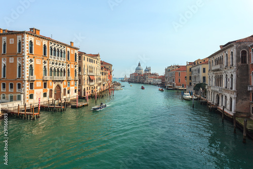 View of Canal Grande. Various boats float by a fine architectural complex of embankments. © k_samurkas