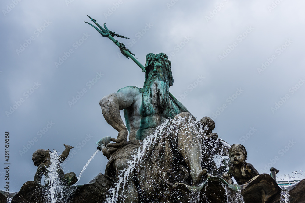 Statue of Neptune Fountain, one of the most iconic fountains of Berlin, Germany. Located on Alexanderplatz beside St Mary's Church and Berlin's Town Hall 