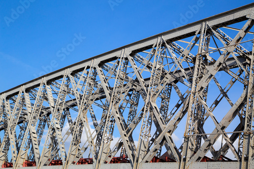   Fragment of a metal railway bridge.Side view.