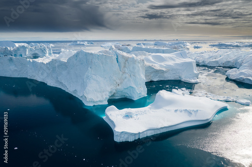 Fotografia, Obraz Aerial view of large glacier and iceberg