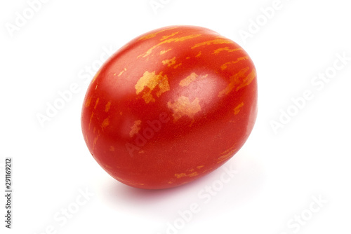 Fresh colorful sweet rustic tomato, isolated on white background