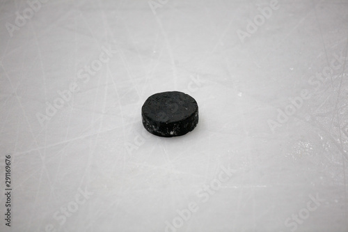 old hockey puck on ice