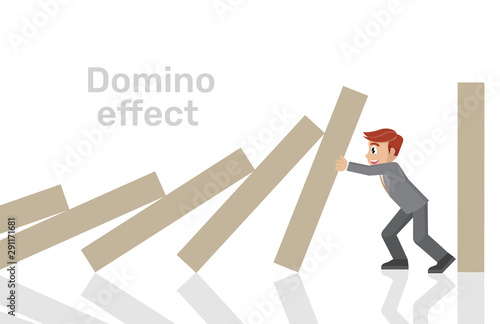 businessman trying to stop domino effect.