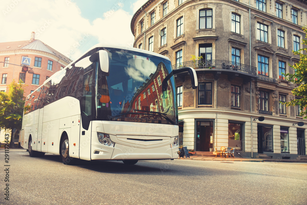 Fototapeta premium tourist bus carries tourists by city