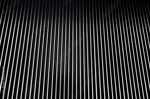 Close up metal escalator stairs, metal textures background 