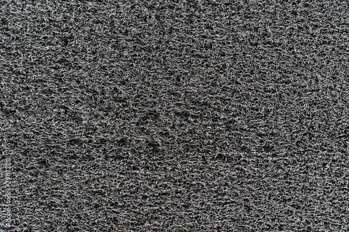 closed up grey plastic fiber carpet background textures