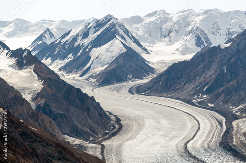 The Kaskawulsh Glacier flows from snowy mountains in Kluane National Park, Yukon, Canada