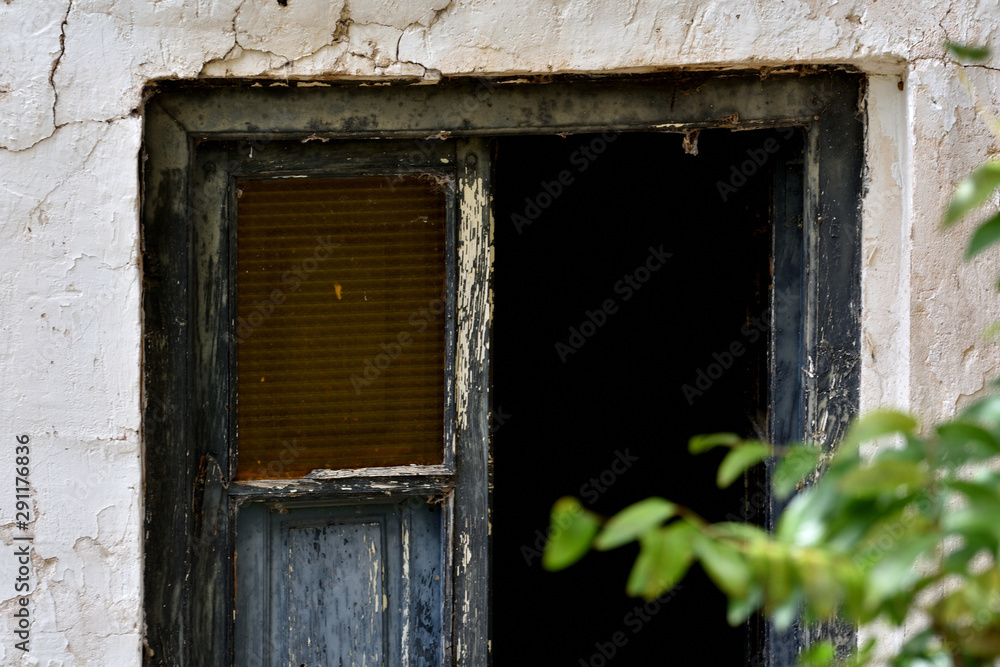 entrance of a ruined house inside the forest entrance of a ruined house inside the forest