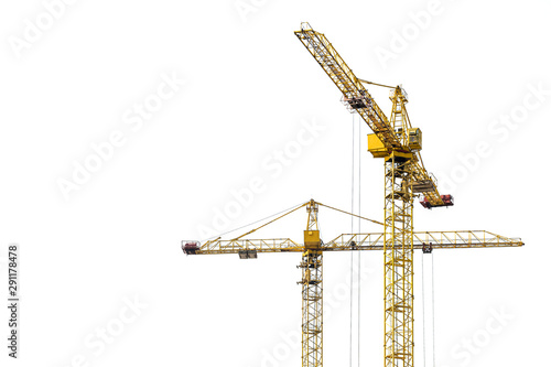 Yellow construction crane on a white isolated background builds multi-storey residential buildings using modern technologies of metal, concrete and brick according to the architectural design