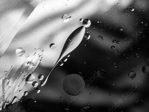 Monochrome surreal psychedelic abstract liquid background. Water and oil drops with small air bubbles photo