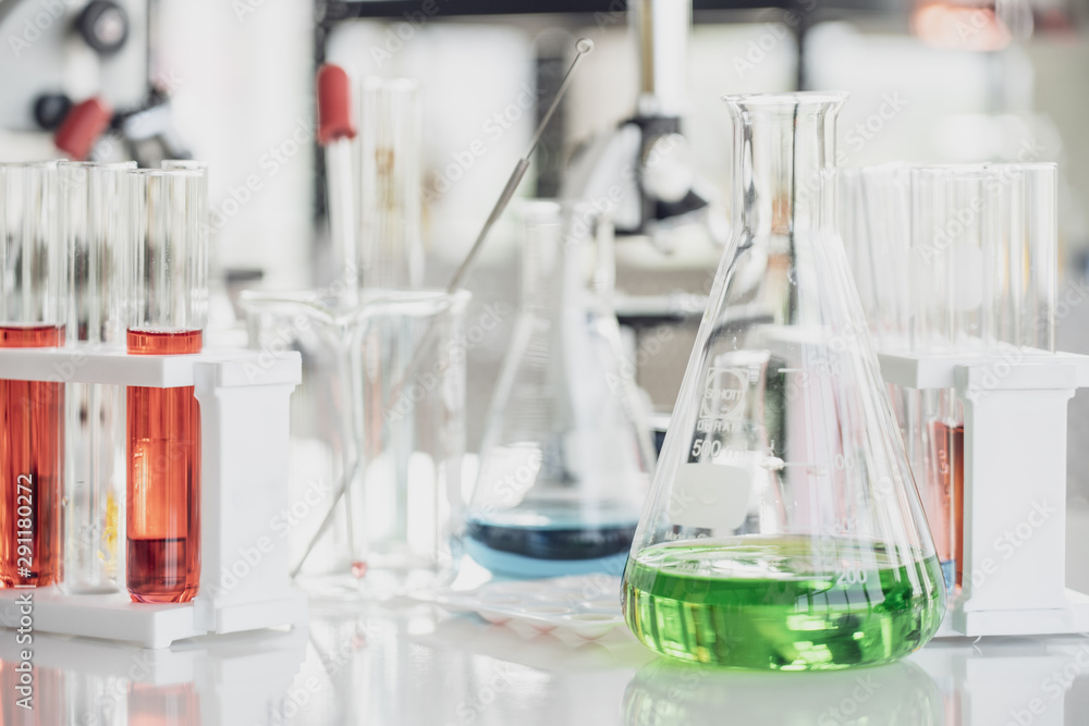 Team of Medical Research Scientist Conducts Experiments in Laboratory with Microscope, Test Tubes, Micropipette and other equipment. Team of Medical Research Scientist Conducts Experiments in Laboratory with Microscope, Test Tubes, Micropipette and other equipment.
