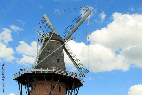 windmill in front of a blue sky
