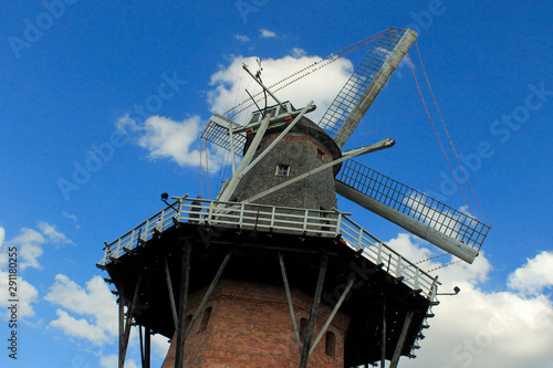 windmill in front of a blue sky