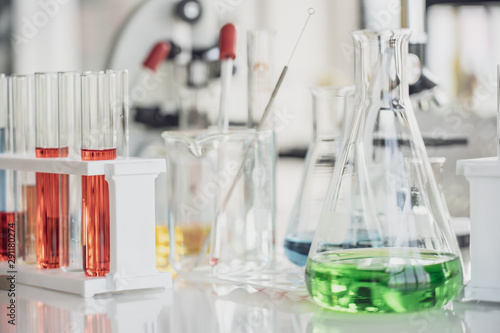 Team of Medical Research Scientist Conducts Experiments in Laboratory with Microscope, Test Tubes, Micropipette and other equipment.
