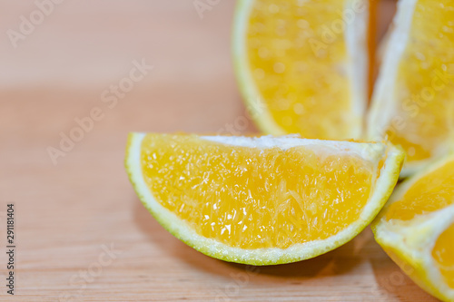 Appetizing Orange cut into slice in macro photo.