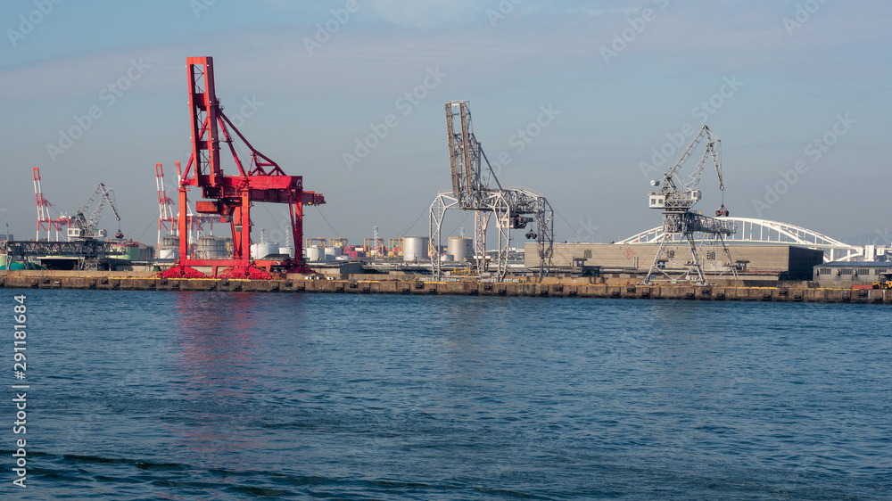 Crane in port of Osaka in Japan. View to the cranes in port