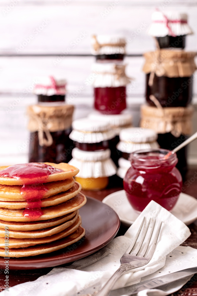 Tasty breakfast. Pancakes with strawberry confiture and butter. Tasty breakfast. Pancakes with strawberry confiture and butter.