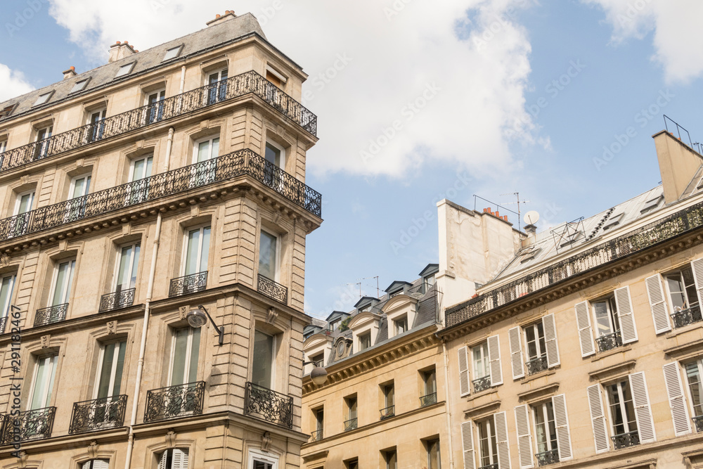 Traditional apartment building in Paris, France. Traditional apartment building in Paris, France.