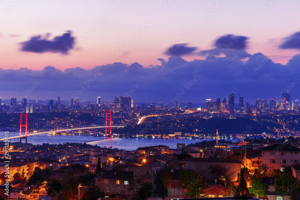 Obraz premium Night Bosphorus Bridge, view on Sisli and Besiktas districts of Istanbul, Turkey