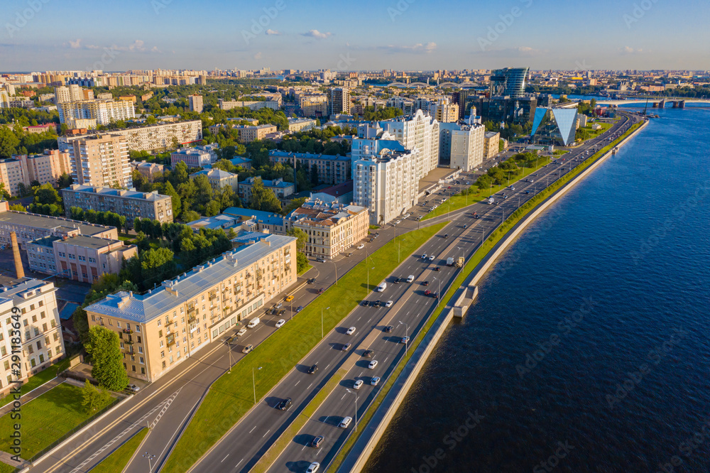 Panorama of Petersburg on a summer day. Top view of Petersburg. Rivers Of St. Petersburg. Blue water in Neva. Malookhtinsky Prospekt. Residential and office buildings on the Neva river. Trip to Russia