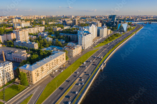 Panorama of Petersburg on a summer day. Top view of Petersburg. Rivers Of St. Petersburg. Blue water in Neva. Malookhtinsky Prospekt. Residential and office buildings on the Neva river. Trip to Russia