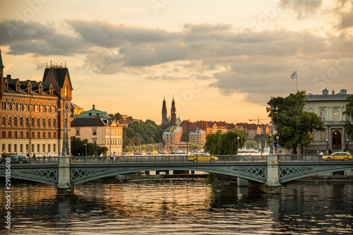 Old Stockholm cityscape, water, bridge, canal. © Olga Ev