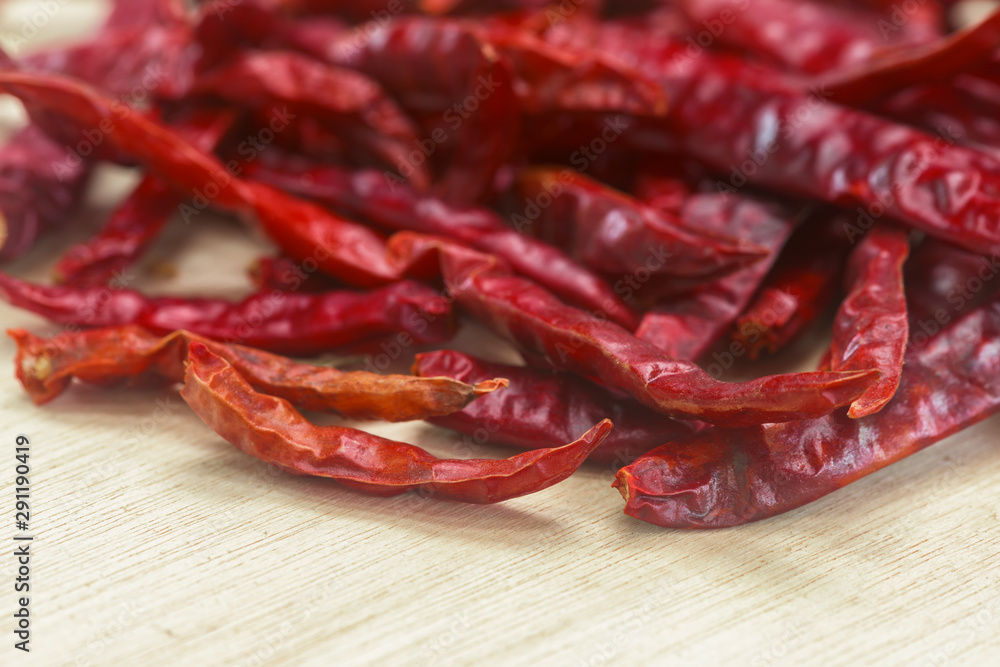 Dried red chilli on wooden table
