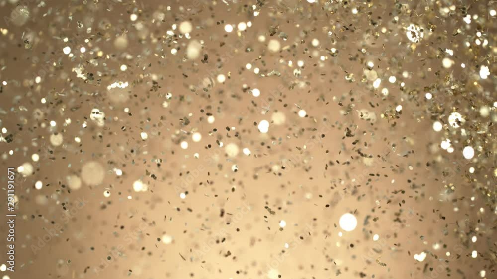 Golden Glitter Background in Super Slow Motion at 1000fps. Shooted with High Speed Cinema Camera in 4K Resolution. Golden Glitter Background in Super Slow Motion at 1000fps. Shooted with High Speed Cinema Camera in 4K Resolution.