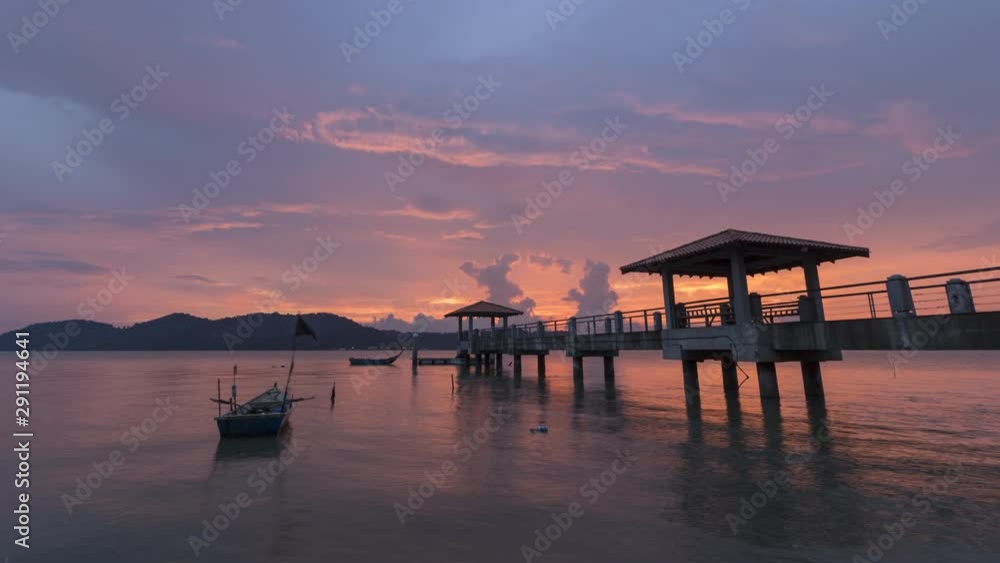 Timelapse sunset near Batu Kawan jetty to Pulau Aman with beautiful ray and moving boat. Timelapse sunset near Batu Kawan jetty to Pulau Aman with beautiful ray and moving boat.