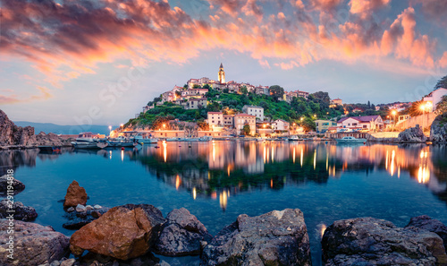 Breathtaking evening cityscape of Vrbnik town. Dramatic summer seascape of Adriatic sea, Krk island, Croatia, Europe. Beautiful world of Mediterranean countries. Traveling concept background. photo