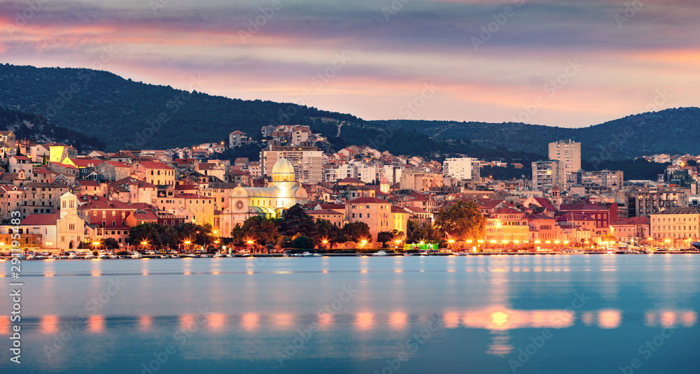 Colorful evening panorama of Sibenik city. Dramatic summer seascape of Adriatic sea, Croatia, Europe. Beautiful world of Mediterranean countries. Traveling concept background.