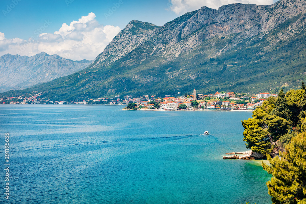 Attractive summer cityscape of Gradac town. Stunning morning seascape of Adriatic sea, southernmost tourist locality of the Makarska riviera in southern Dalmatia, Croatia, Europe.