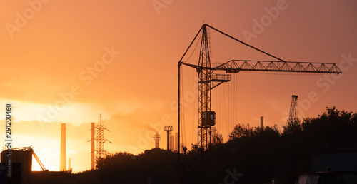 plaant, crane at sunset, indsudtrial city,  photo