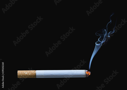 Cigarette burning isolated on black background