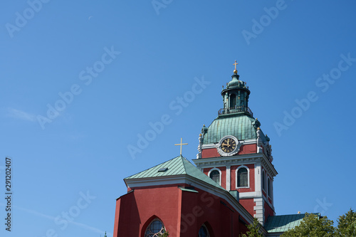 A Clock tower of Saint James's Church in Stockholm, Sweden against a clear blue sky. Copy space.
