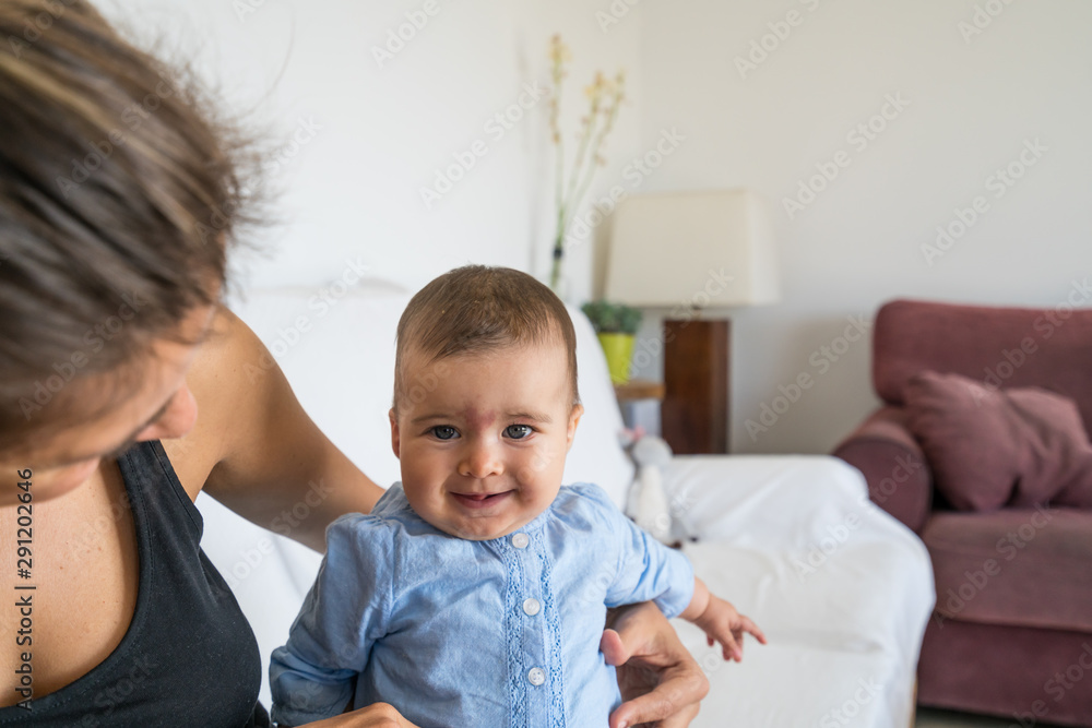 Happy and smiling baby of 7 months, plays with her mom. Happy and smiling baby of 7 months, plays with her mom.