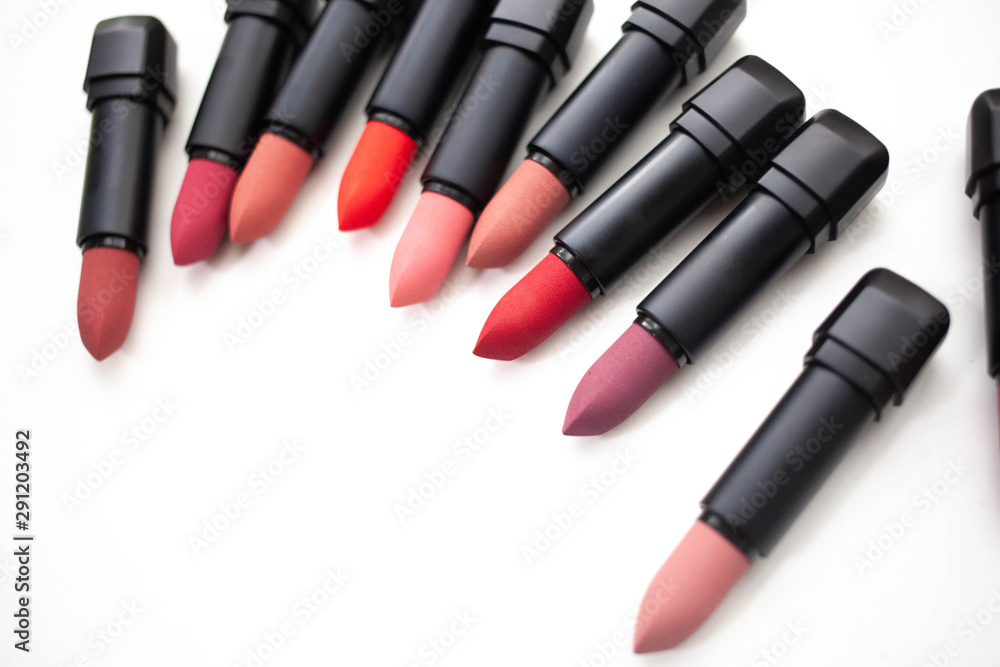 lipstick in different natural colors on a white background. Top view lipstick in different natural colors on a white background. Top view