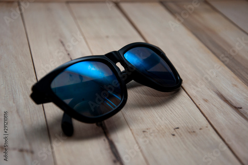 sunglasses on background of blue sky