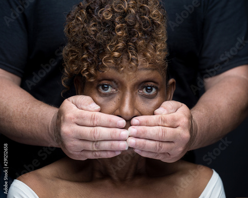 Black woman being silenced by white man in racism photo