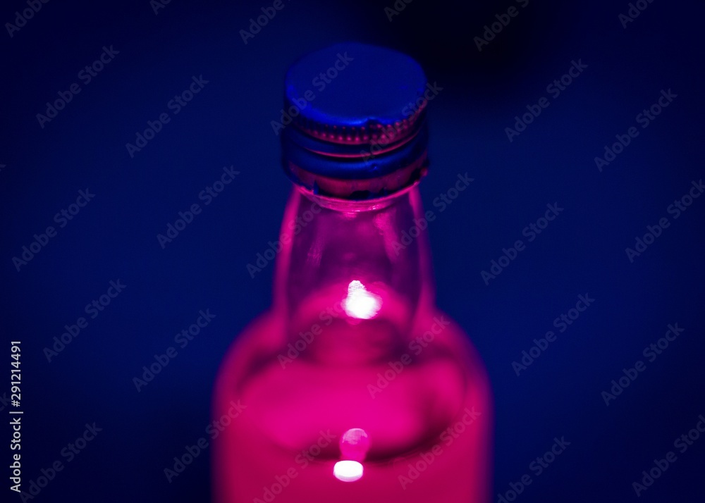 pink bottle on blue pink bottle on blue