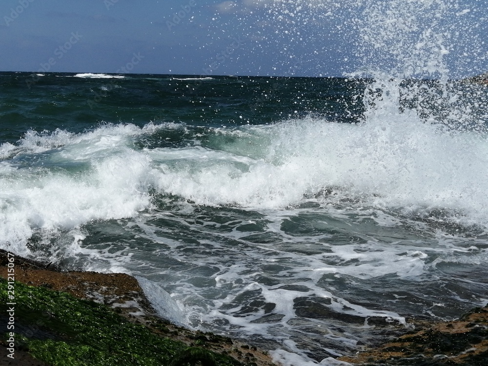 Fototapeta premium Beautiful pictures taken from the Mediterranean Sea embody the flow of water and the beautiful appearance of the collision of water rocks and scattered into wonderful drops