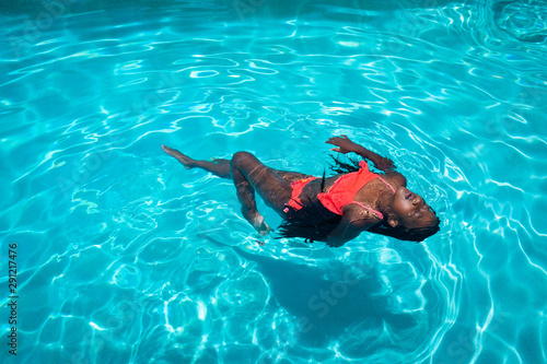 Girl in Pool with Braids