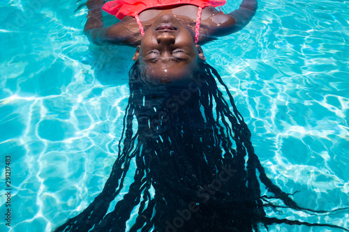 Girl in Pool with Braids