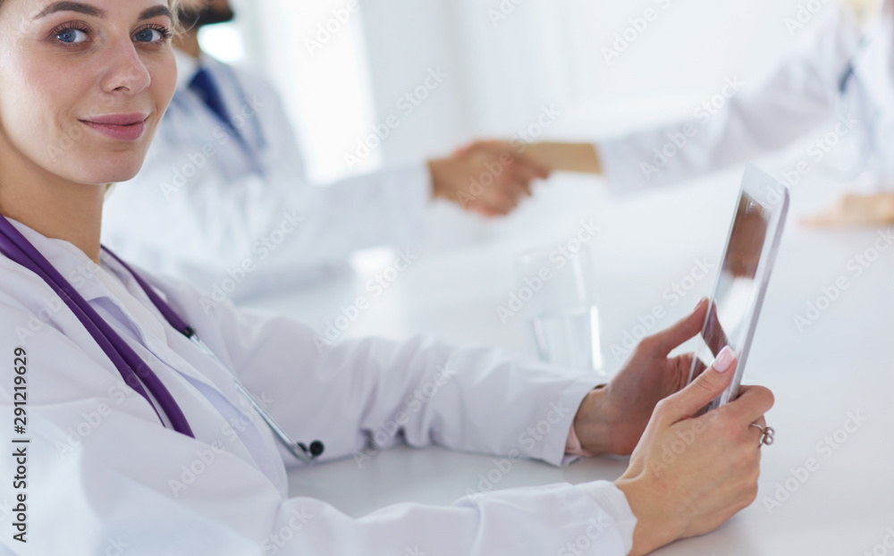 Team of doctors having consultation in clinic Team of doctors having consultation in clinic
