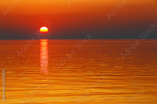 Picturesque golden sunset on the sea © alexhitrov
