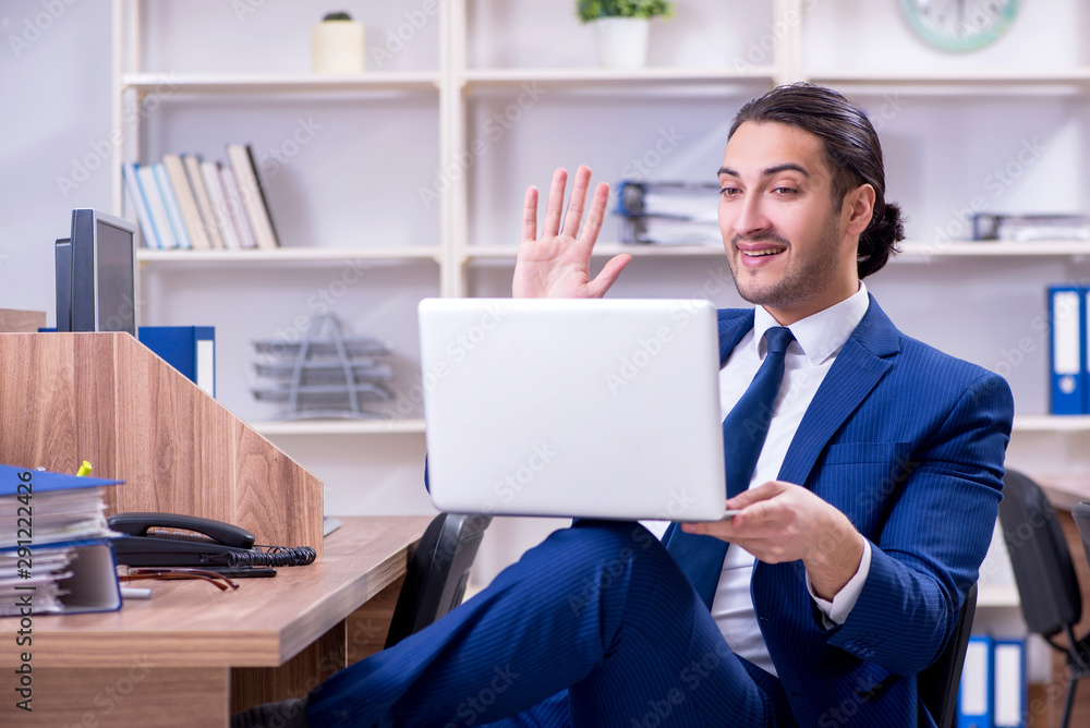 Young handsome businessman working in the office Young handsome businessman working in the office
